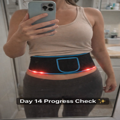 Person taking a mirror selfie wearing a black waist trainer with LED lights, holding a phone.